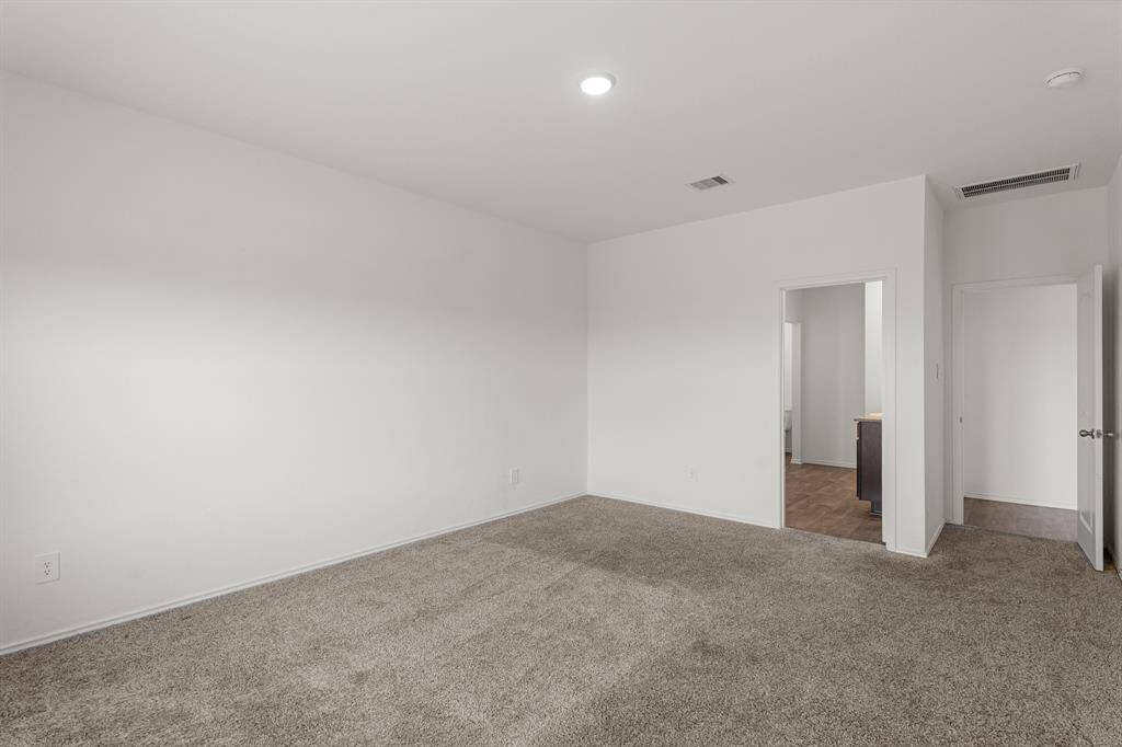 Come and unwind after a long day in this primary bedroom with an ensuite bath and huge primary closet!