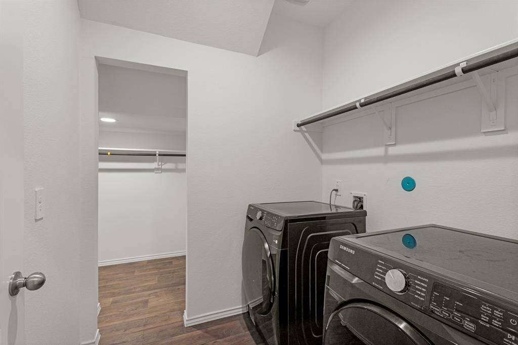The laundry room is conveniently located off the main living area and connects to the a huge storage closet!