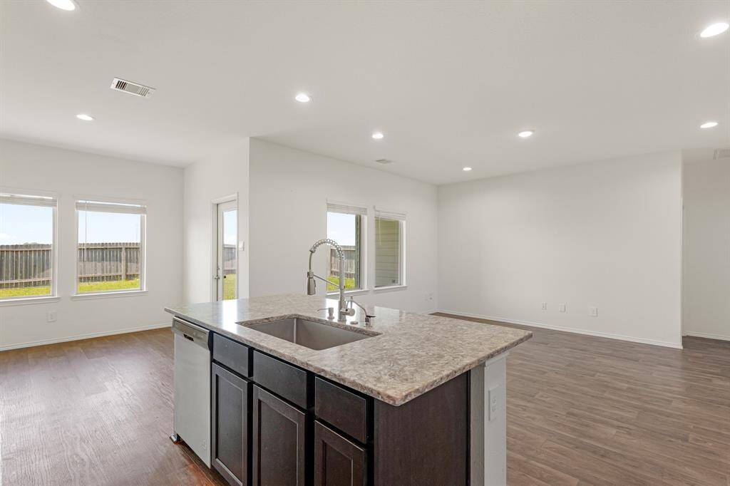 The heart of the home is its open-concept kitchen and living area, ideal for entertaining or relaxing with family.