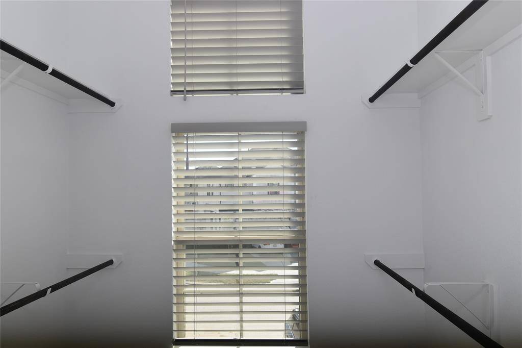 Spacious primary closed flooded with natural light