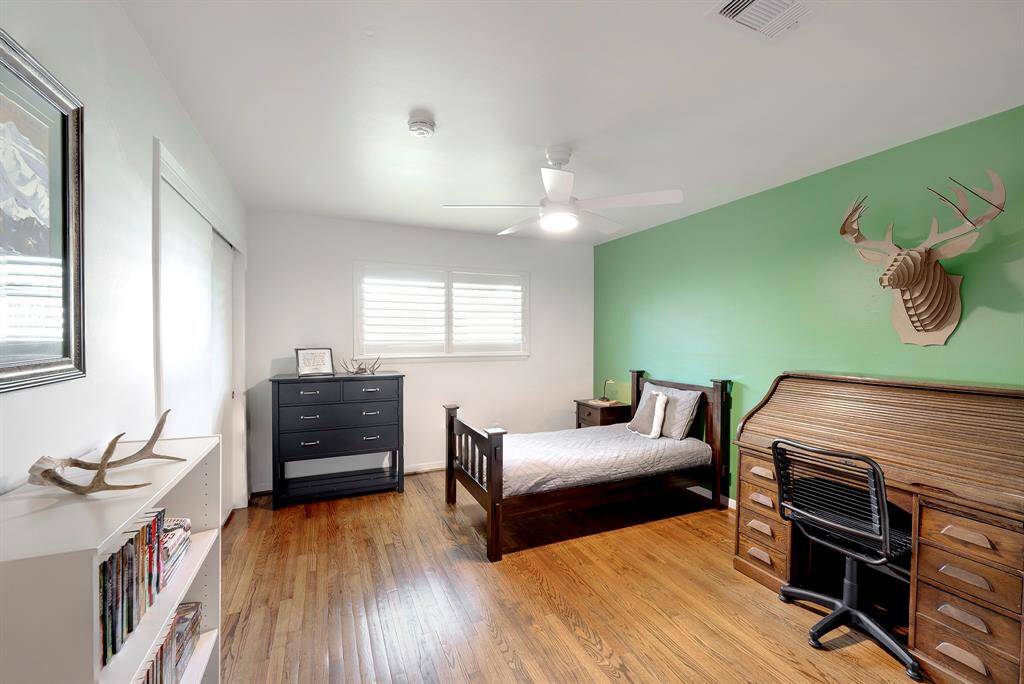 Secondary bedroom with  hardwood floors