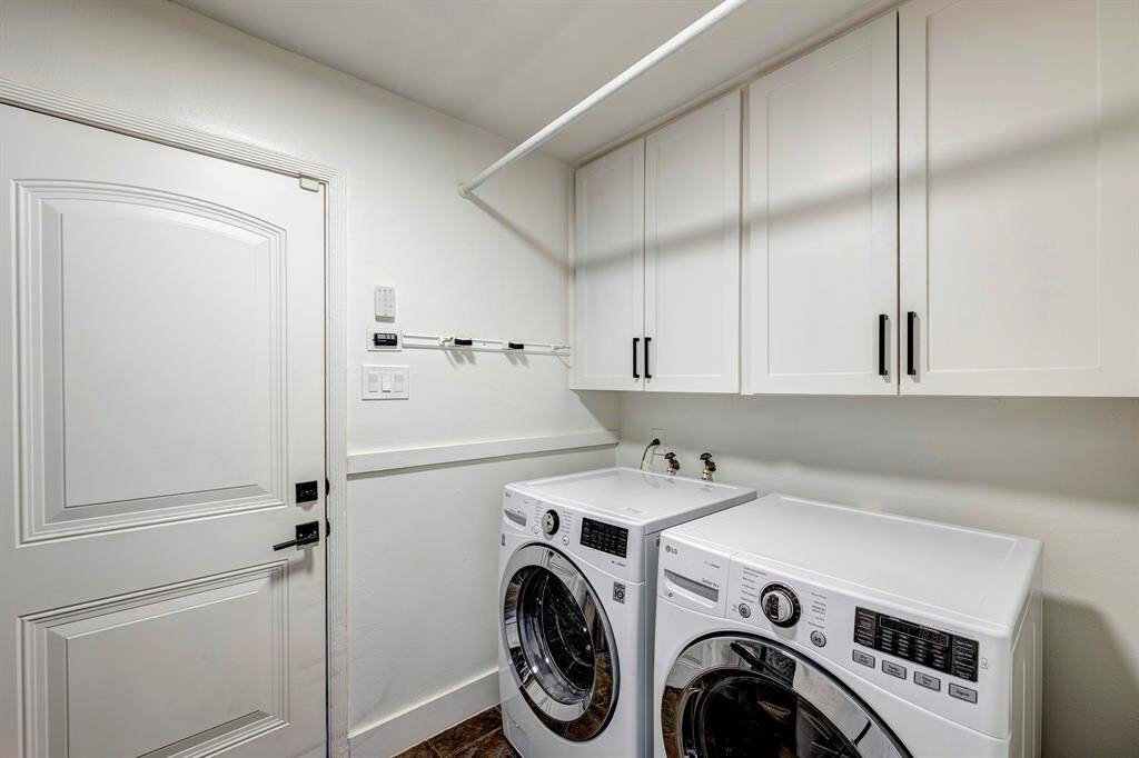 Large utility room with storage over the w/d and storage to the left (out of frame)