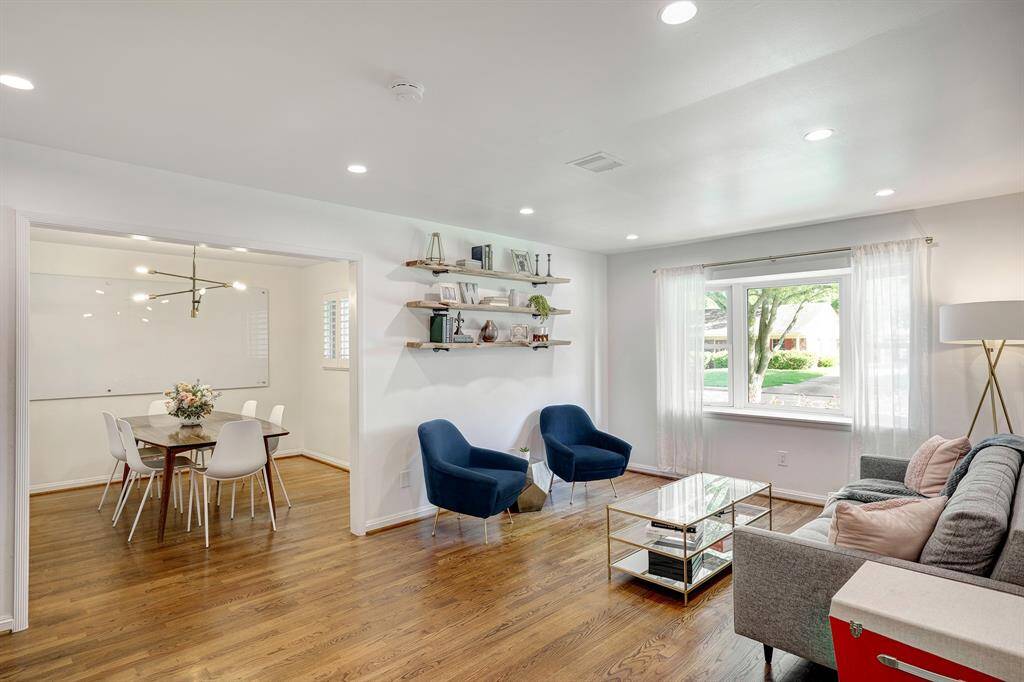 As you enter the home, you have a formal living space with a sunny bay window and formal dining room behind