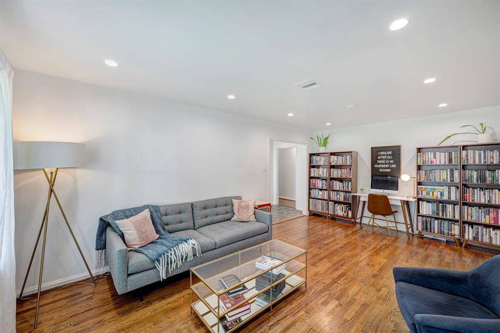 Formal living room with upgraded lighting and beautiful hardwood floors