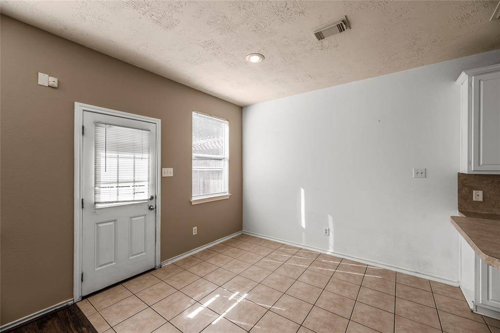 The dining area, conveniently located next to the kitchen and living room, offers plenty of space for a large table—perfect for family meals and gatherings!