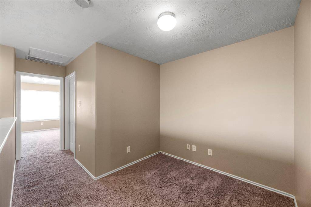 This inviting nook can easily be transformed into a charming home office or a peaceful study space, perfect for focused work or quiet reflection.