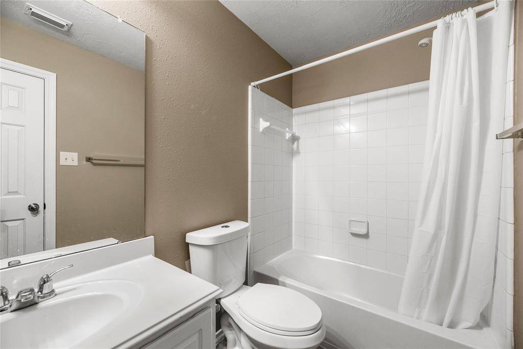 The secondary bathroom is stylishly appointed and thoughtfully designed for comfort and convenience.
