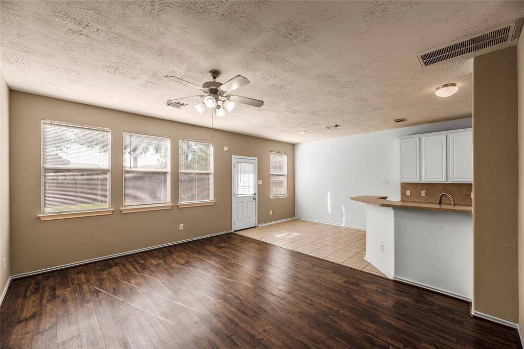 The first floor boasts a spacious open-concept design, seamlessly connecting the living room, dining area, and kitchen—perfect for both everyday living and effortless entertaining.