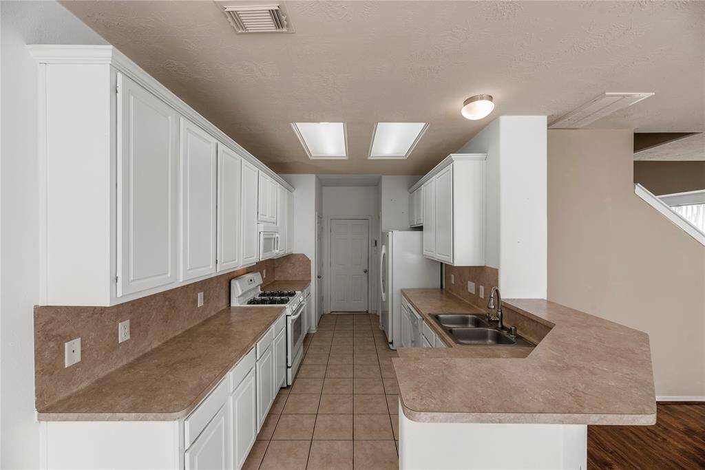 Your chef inspired kitchen awaits! Features include easy care countertops, high performance appliances, crisp white cabinets, tons of lighting, and breakfast bar seating.