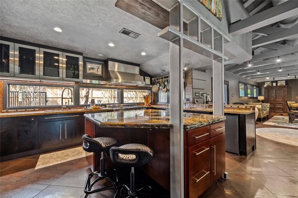 Designed for both functionality and entertaining, this open-concept space seamlessly blends style and convenience.