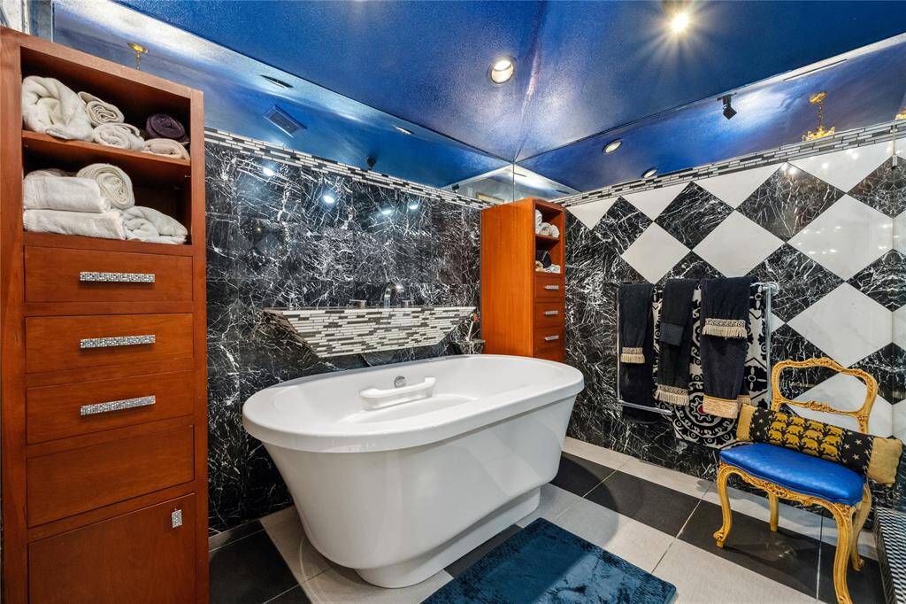 The primary suite bath is spa-inspired, featuring a luxurious jetted and soaking tub, offering the perfect place to unwind.