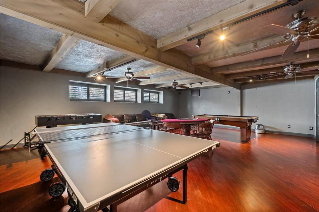 The game room, located above the garage, offers a versatile space for entertainment and relaxation. With plenty of room for activities, it's the perfect spot for family fun or hosting guests.