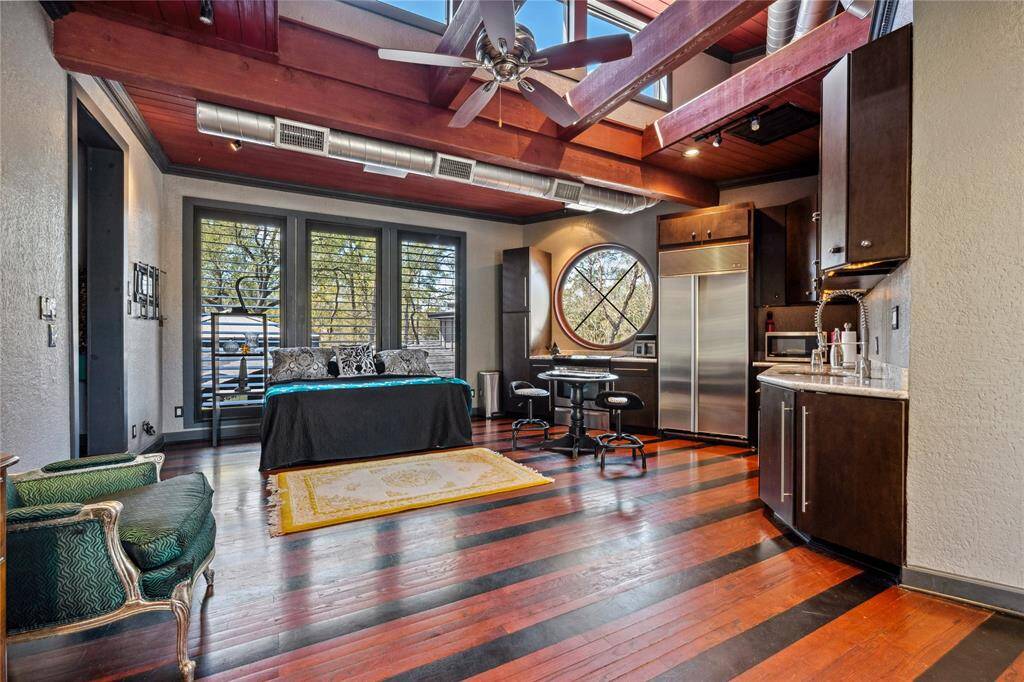 Another view of the Tree House guest apartment highlights its elevated design, perched among the trees for an immersive natural experience. The space is filled with light and offers a peaceful, private atmosphere with scenic views, making it an ideal retreat.