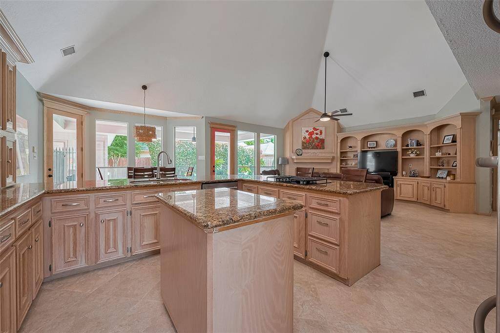 Tons of cabinets in this beautiful island kitchen and plenty of storage throughout this appx 3,648 sqft home.