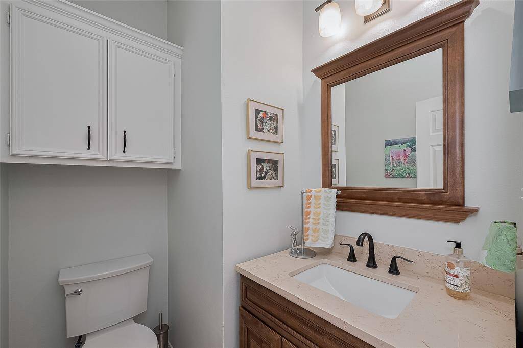 Updated guest bathroom with vanity, undermounted sink, plumbing/hardware, mirror and lighting.