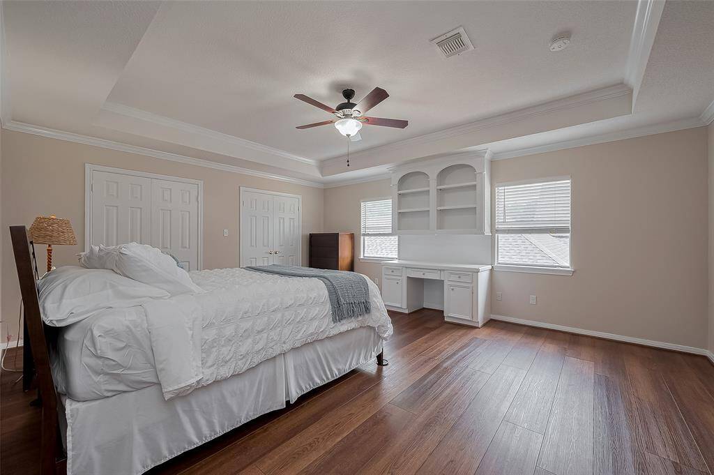 Bedroom #3 is HUGE!!  Notice the tray ceilings as well as additional custom built-ins.