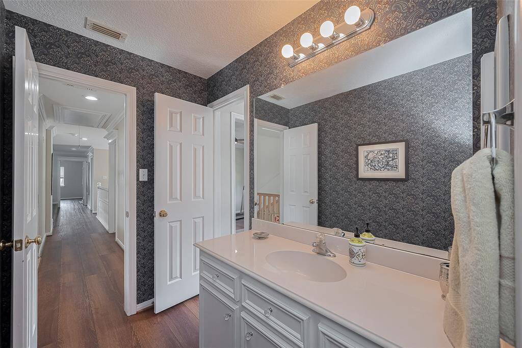 Full bath #3 off of Bedroom #4 at end of hallway.