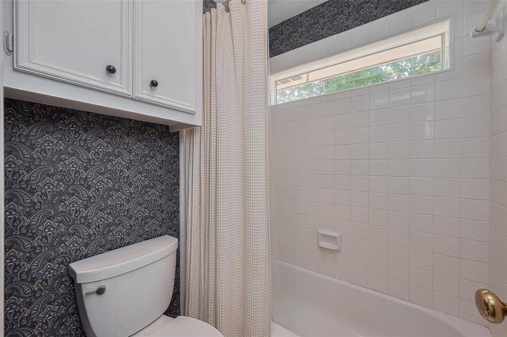 Full bath #3  Transom window above the tub/shower bringing in more natural light.