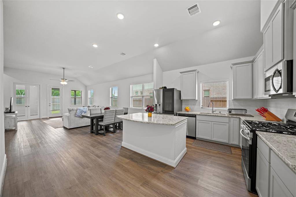 Open Concept Living Spaces with lots of Windows for Natural Light.Home has Easy-Care Laminate Plank Flooring and Recessed Lighting.