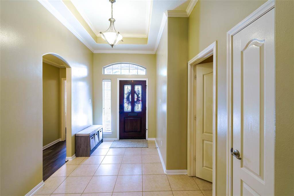 Directly to the right of the front entrance is the hallway that leads to the secondary bedrooms and bathroom.