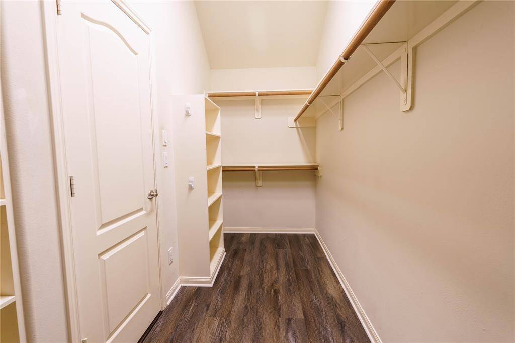 Walk-in primary closet is  conveniently located with direct access from the primary bathroom!