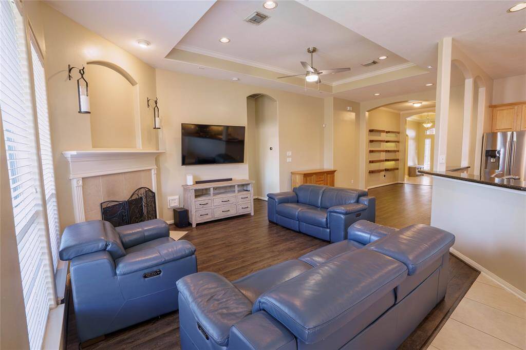 This living room is ready to entertain family and friends! Notice the beautiful fireplace for the cold months!
