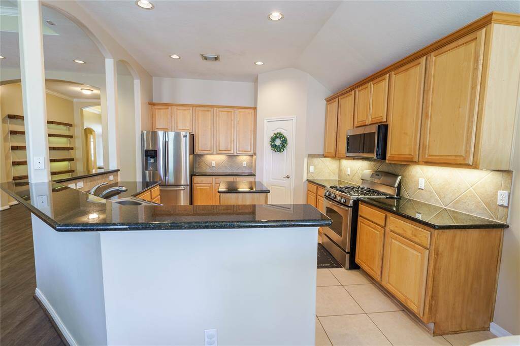 Kitchen has easy access to the living room!