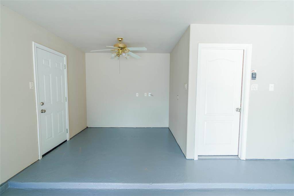 Look at this great additional space in the garage! This could be your next workshop or workout area with direct access to your private side yard! The possibilities are endless!