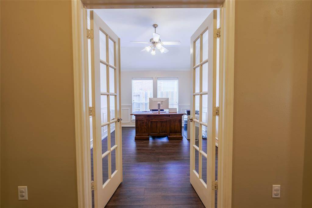 The French doors lead to the office/study area.