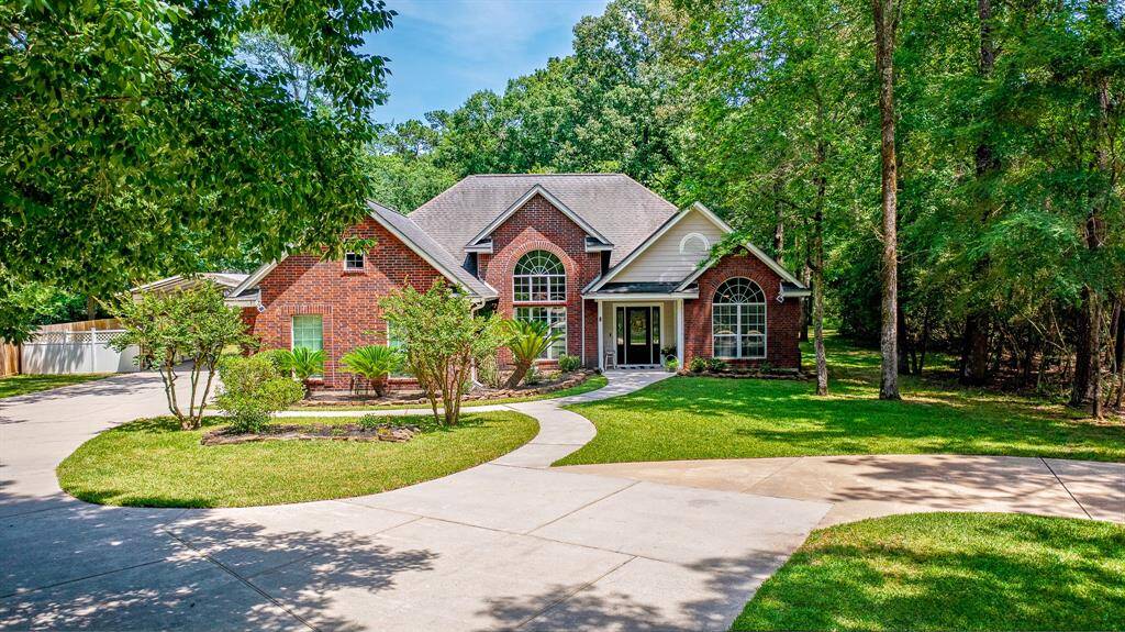Welcome Home to 6 Lake Forest - dream living nestled on one acre.