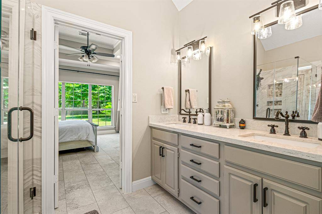Gorgeous granite countertop with double drop in sinks with black finishes throughout.