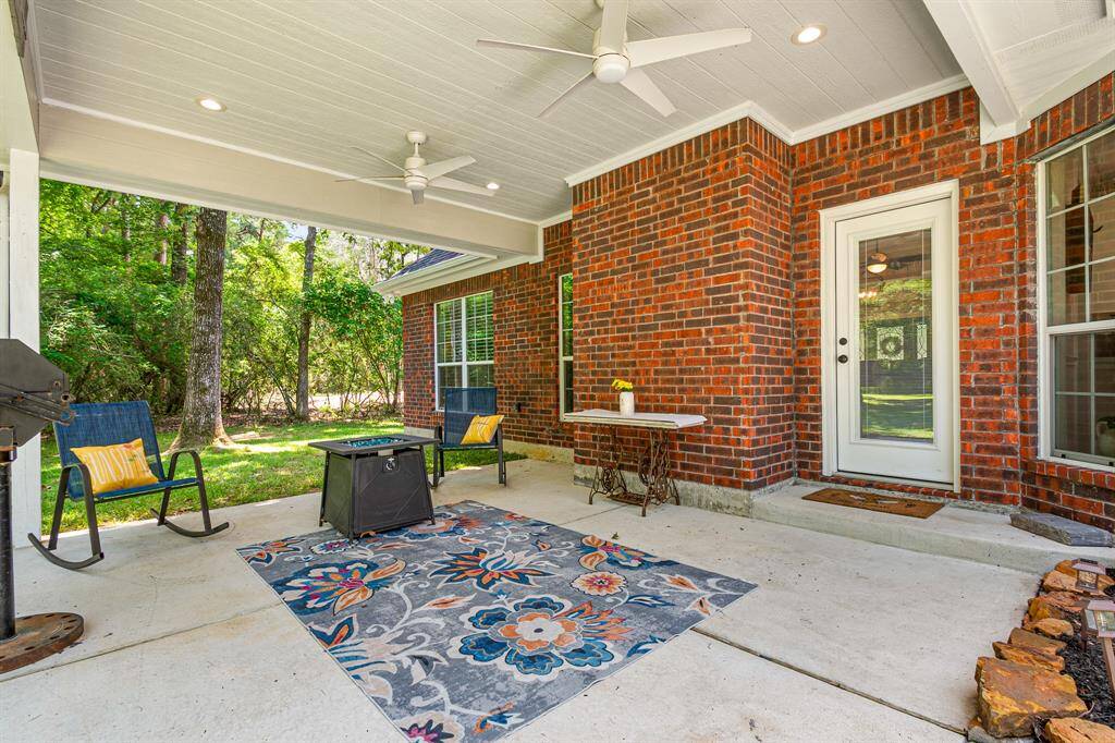 This huge covered back porch offers the ideal spot to unwind