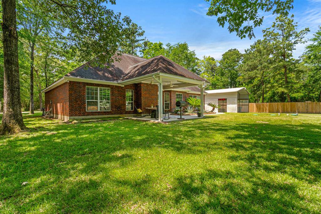 Find your peace in the backyard nestled amongst the canopy of trees.