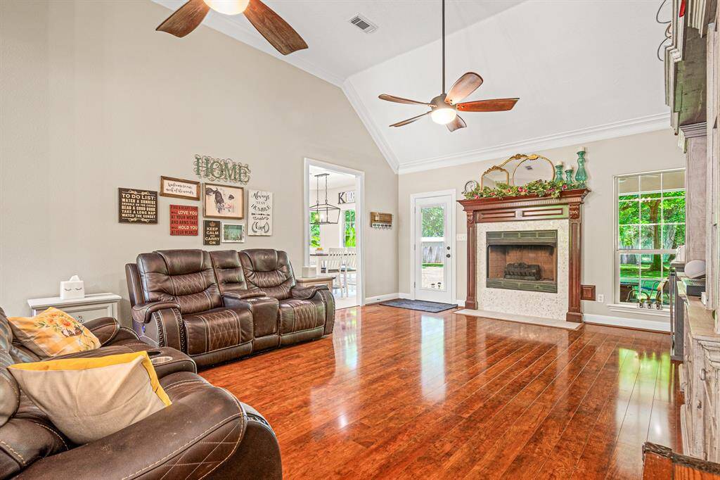 Elevated Ceiling and Thoughtful Light Fixtures add to the Openness of this Inviting Room