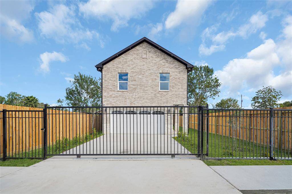 Crisp front view showing paved driveway and curb appeal.