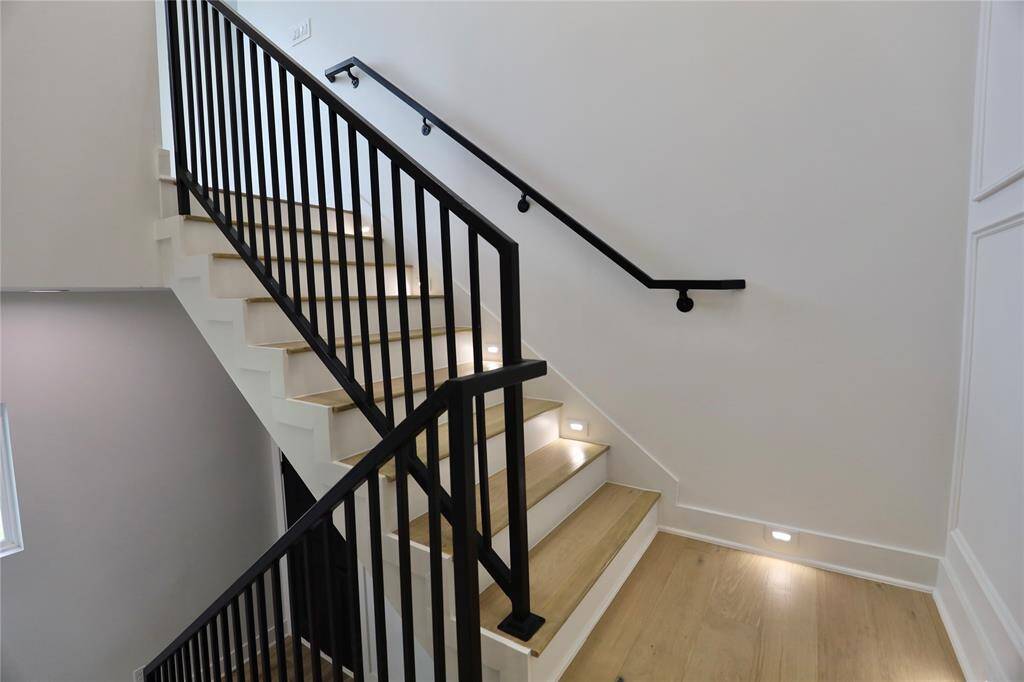 illuminated by soft stair step lights — a graceful touch of elegance.