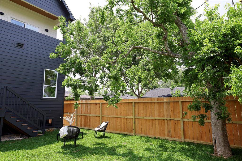 Overlook your HUGE backyard from your primary suite.