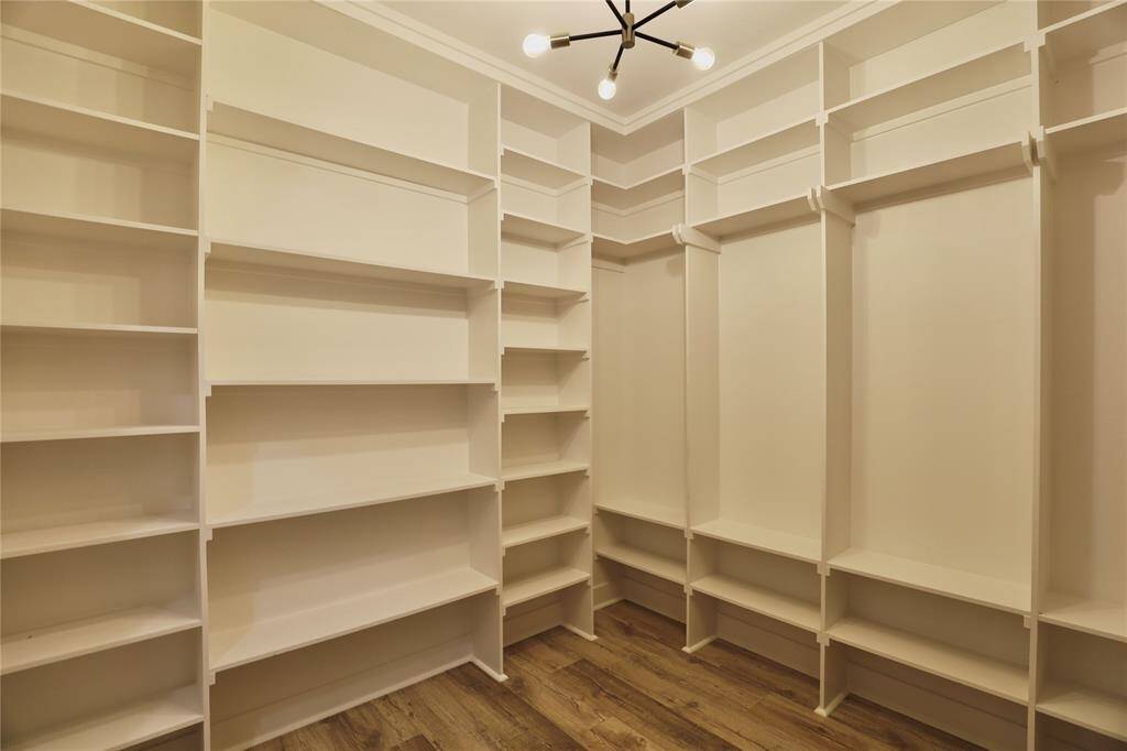 Showcase your shoe, bag or hat collection with the floor to ceiling custom cabinetry.