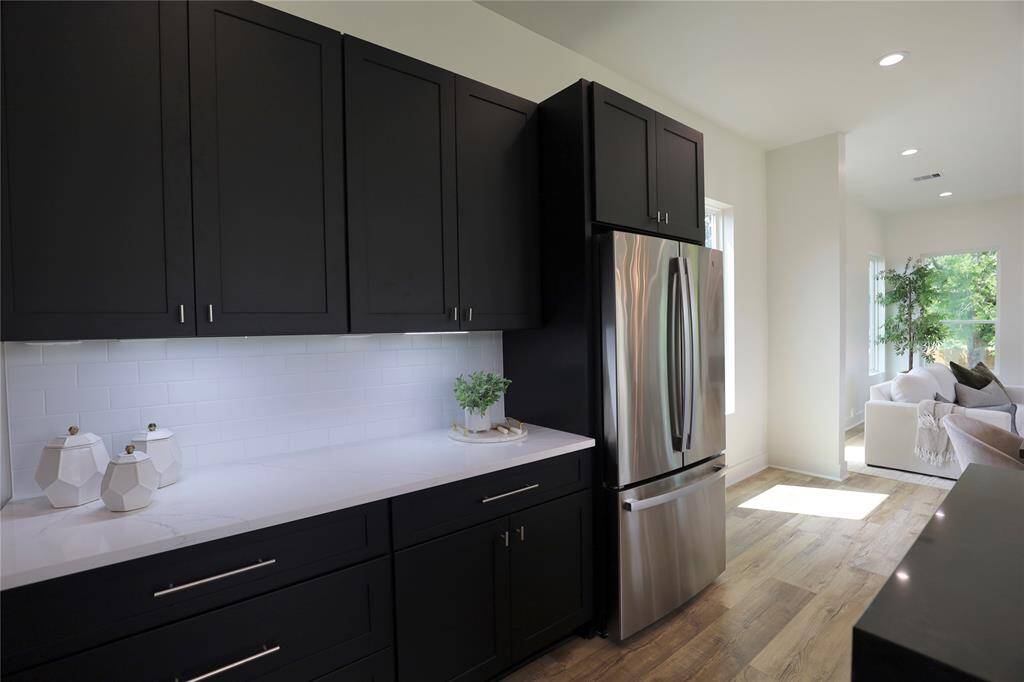 The appliance package is complete with a GE refrigerator, while upgraded drawers and 10 sleek cabinet hardware pieces elevate storage to a whole new level of function and style.