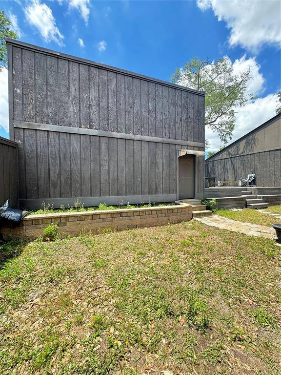 View of backyard and garage