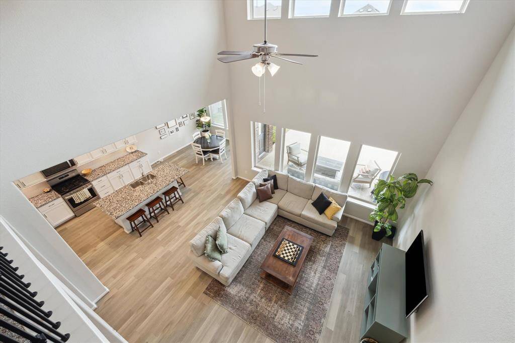 From the game room you can see the spacious family room, kitchen and breakfast area