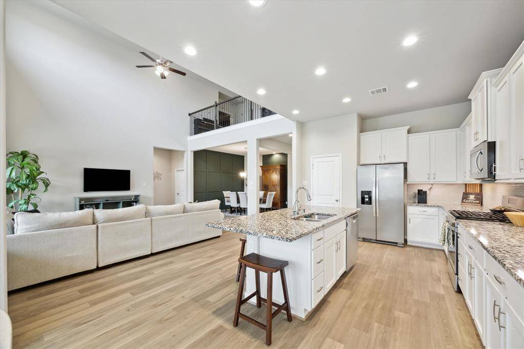 View from breakfast area, the kitchen is in the heart of the home.