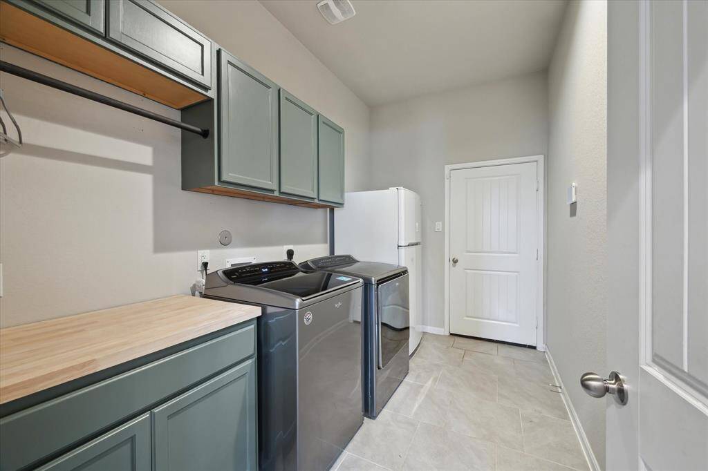 Utility room leads out into garage.  Plenty of space to store your cleaning products and supplies.  Bonus is the area to fold clothes when they come out of the dryer.