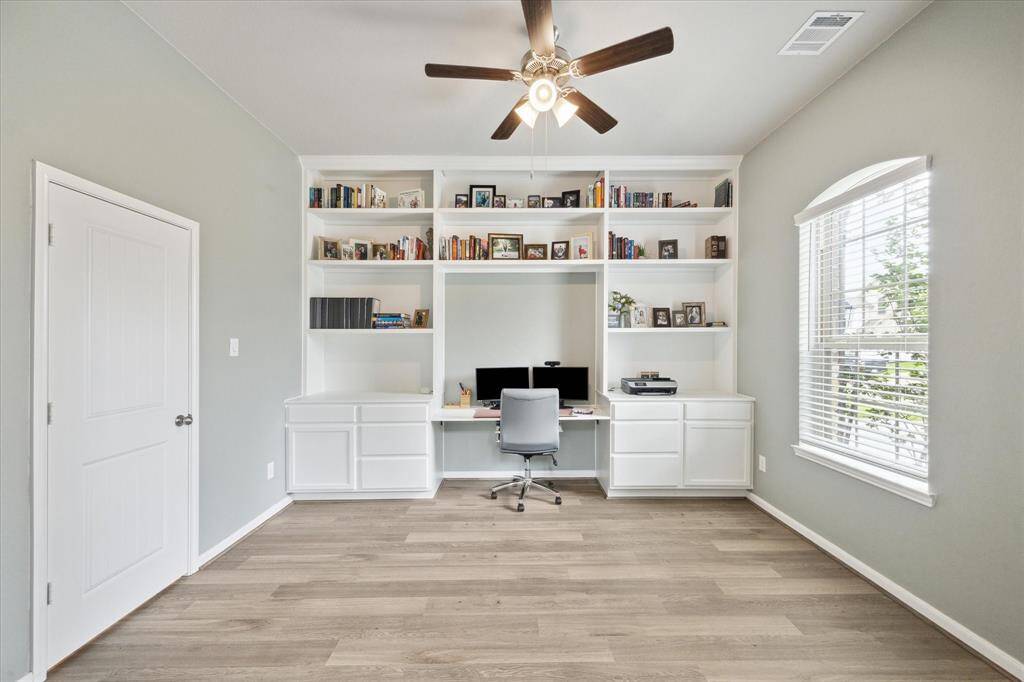 The study is located downstairs at the front of the home with custom built ins and a nice closet.