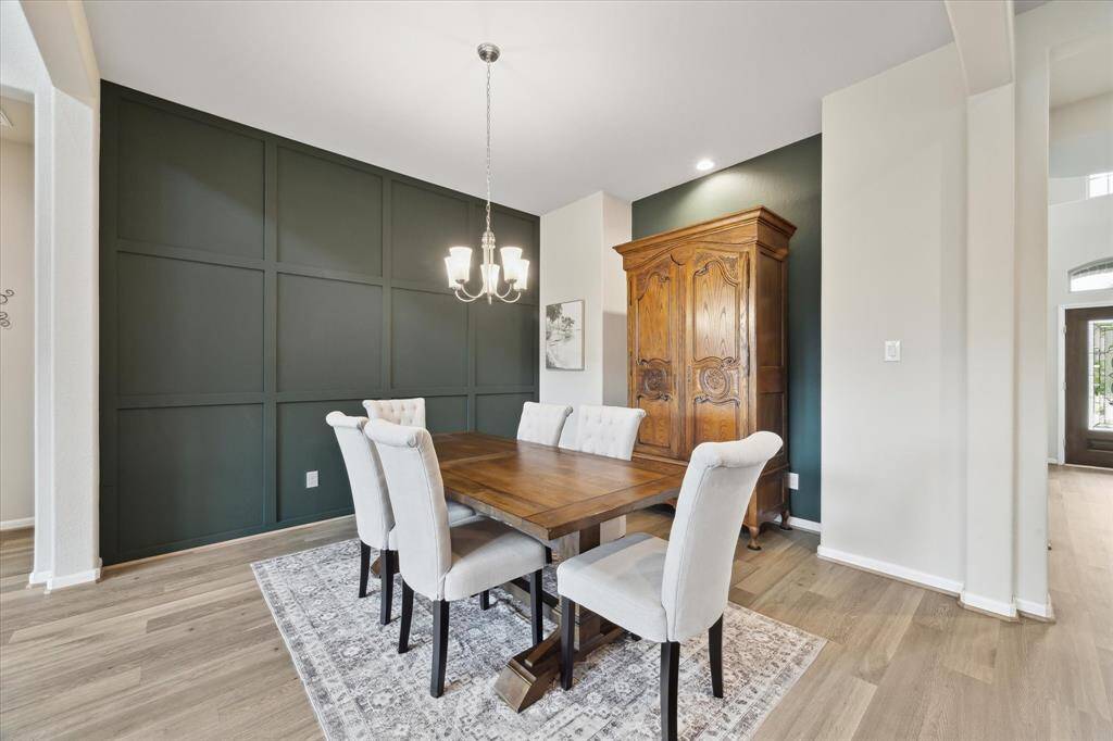 Dining area located in an open area, so it is perfect for entertaining. The beautiful accent walls are an elegant touch for this area.