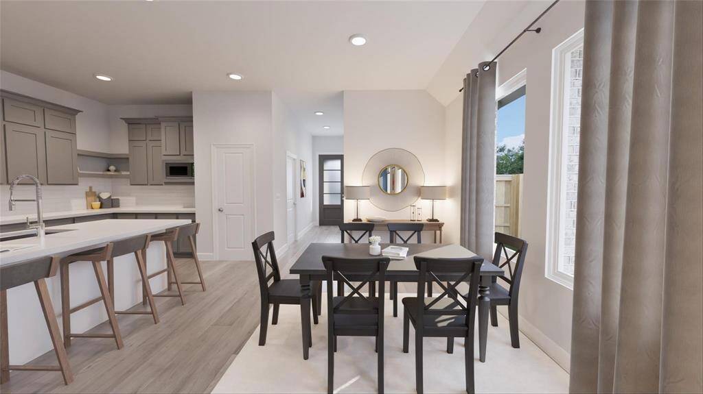 Cozy dining area perfect for gatherings, seamlessly connected to the living space for easy entertaining.