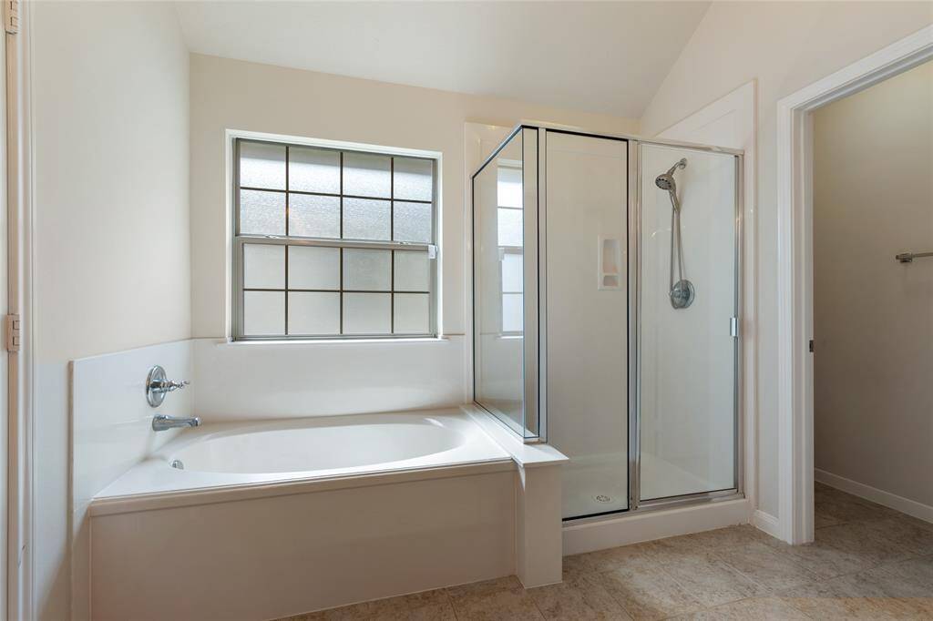 Separate shower and tub in primary suite