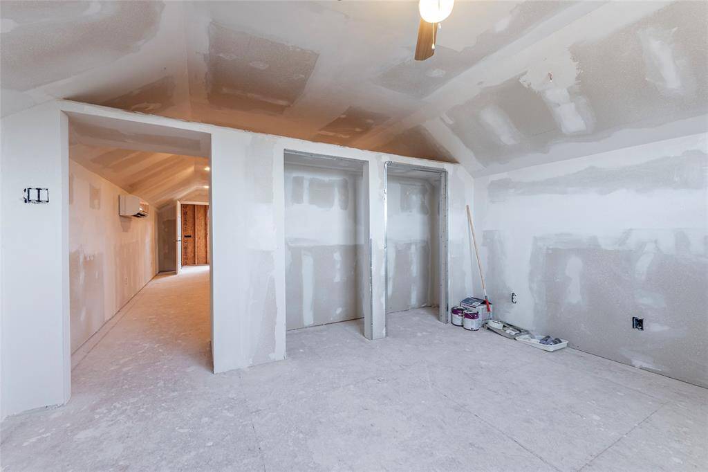 Double closets in bedroom above garage