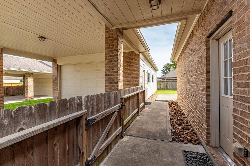 Breeze way going into garage and backyard