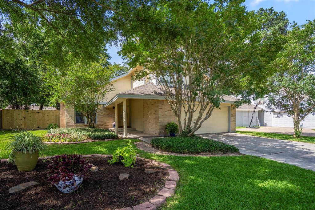 Welcome to 6806 Peace River Drive, nestled beneath mature trees with well-maintained landscaping that adds curb appeal and a sense of privacy.